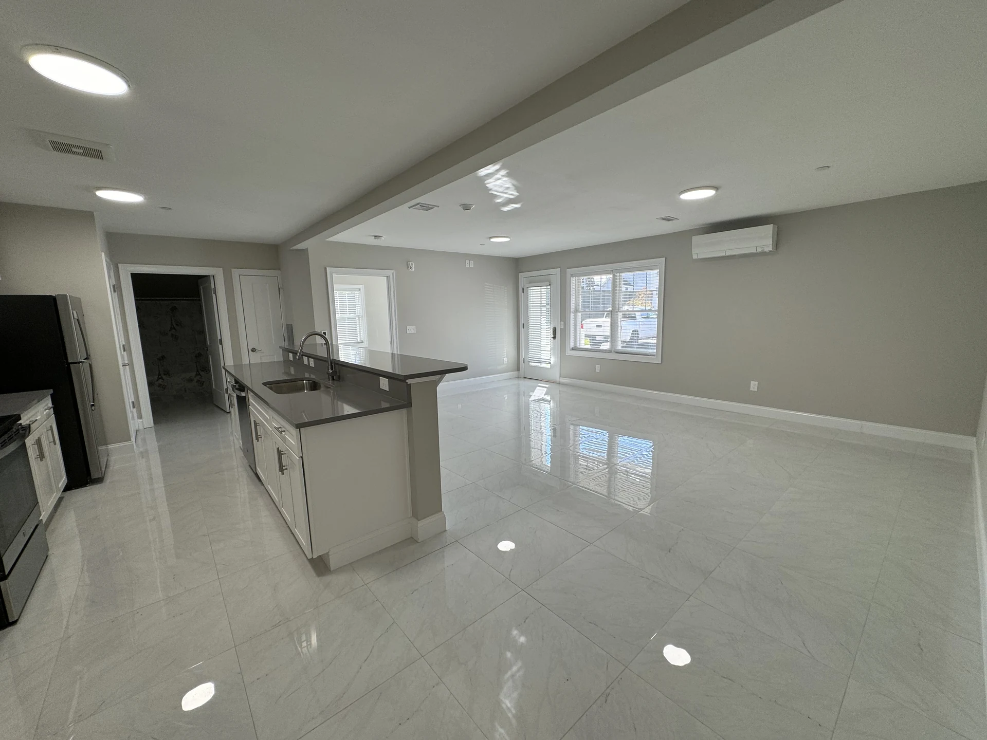 Open kitchen and living space in an example Foster Place apartment