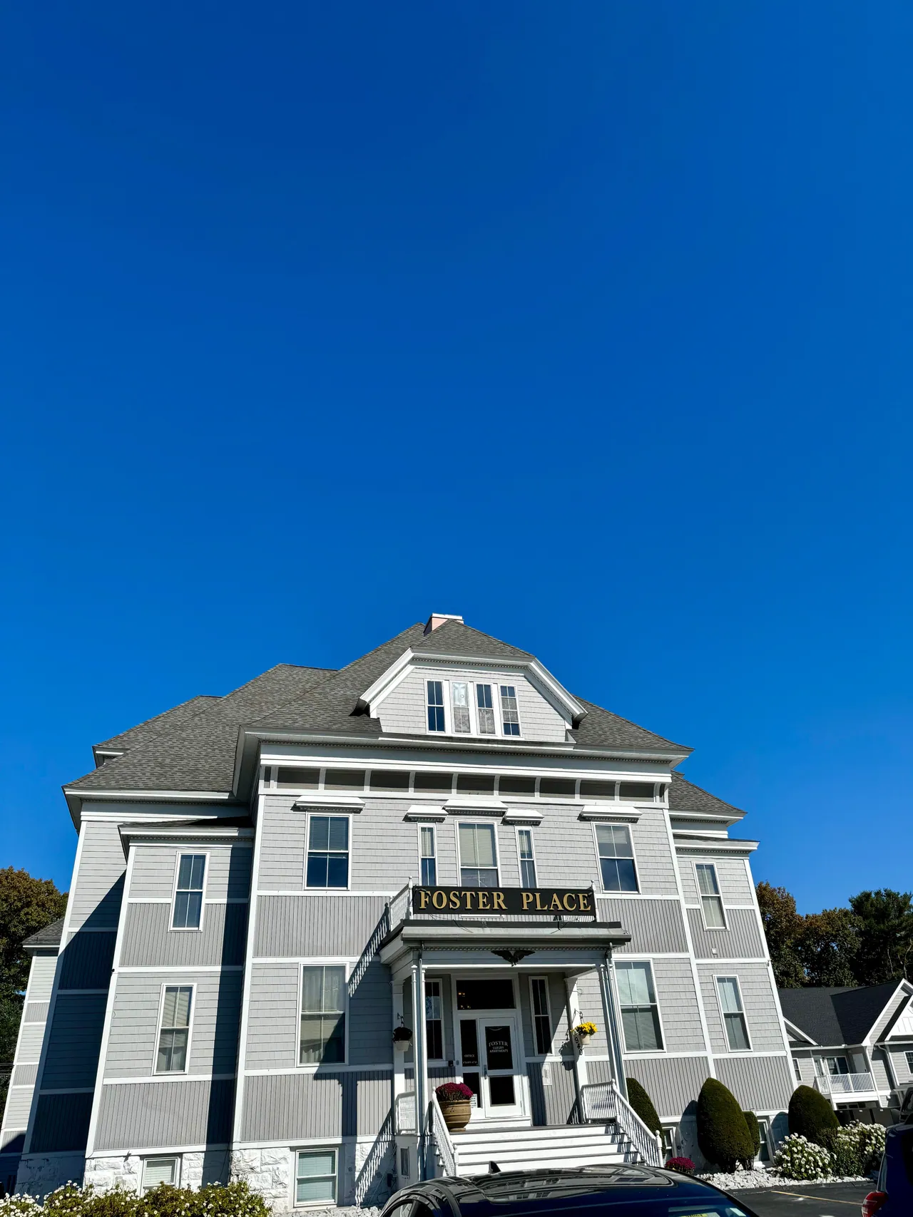 Front view of Foster Place beneath a blue sky