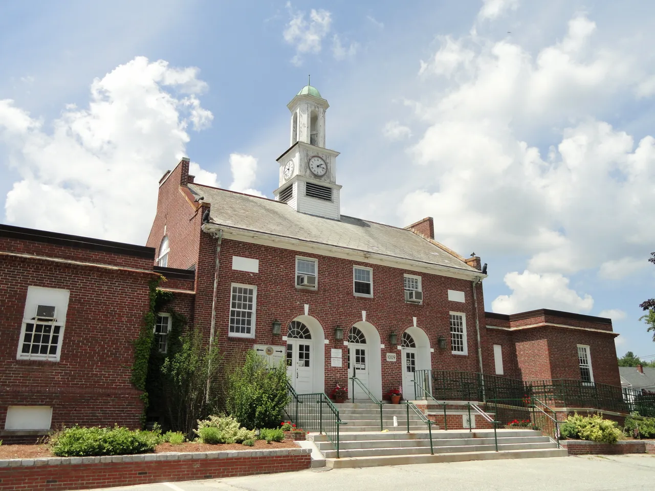 The brick facade and clock tower of Tewksbury Town Hall